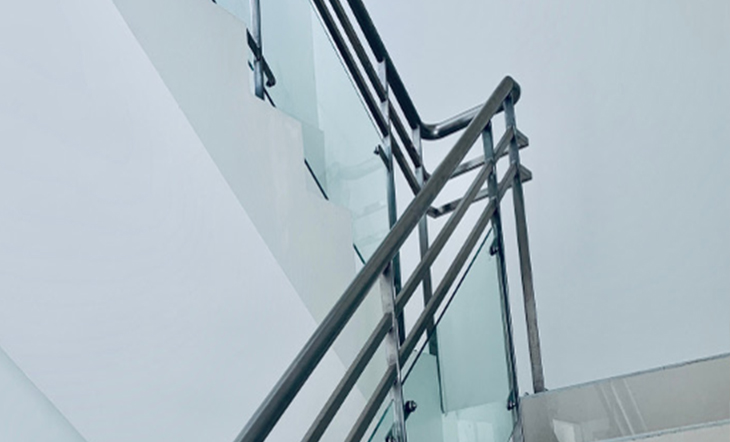 Glass handrails with stainless steel top rails